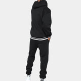 Men's black hoodie and joggers set in fleece material, showcasing a stylish streetwear design with long sleeves and a comfortable waist fit.