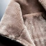 Men's black insulated waterproof thermal winter jacket with long sleeves, featuring a close-up of the fabric texture and detailed stitching patterns. The jacket appears to be comfortable and designed for cold weather.