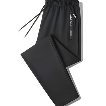Men's black joggers in a lightweight fabric, designed for athletic use. The pants feature zippered pockets and are shown in a 4XL size.