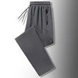 Men's dark gray joggers in size 4XL featuring a lightweight design and zippered pockets.