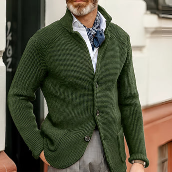 Men's green knit blazer in size 3XL, featuring a formal cardigan style with long sleeves and a sleek design suitable for outerwear. The blazer is made from a textile material with jersey-like characteristics, presenting a sophisticated appearance.