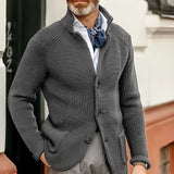 Men's gray knit blazer designed as a formal cardigan in a 3XL size, worn by a model with a beard. The blazer features a sleek and modern look, with elements of tartan pattern, highlighting fashion-forward outerwear with long sleeves and a tailored waist.