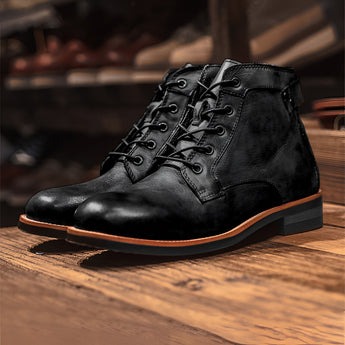 Men's black leather ankle boots featuring a stylish lace-up design and durable rubber sole, ideal for both casual and work settings.