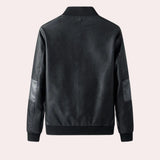 Men's black leather bomber jacket with faux sleeves and a tailored fit, featuring a classic collar and sleek design.