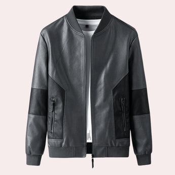 Men's tailored fit bomber jacket featuring black leather body with faux gray sleeves; designed with a collar and button details, available in size XL.