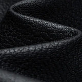 Men's black leather bomber jacket with tailored fit and faux leather sleeves, displayed on a mannequin or laid flat against a neutral background.