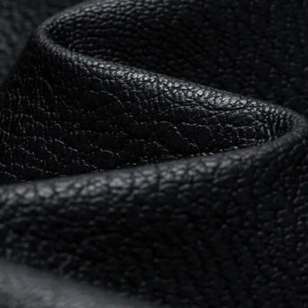 Men's black leather bomber jacket with tailored fit and faux leather sleeves, displayed on a mannequin or laid flat against a neutral background.