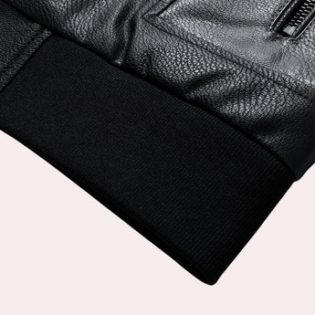 Men's black leather bomber jacket with faux sleeves and a tailored fit, featuring a hood and collar design, displayed on a grey background.