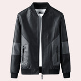 Men's tailored fit black leather bomber jacket with faux grey sleeves and a collar, size XL.