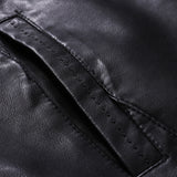 Men's black leather motorcycle jacket with zipper and button collar, featuring sleeves with a close-up view of the material texture, and side pockets, stylishly presented in a fashion-forward design.