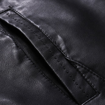 Men's black leather motorcycle jacket with zipper and button collar, featuring sleeves with a close-up view of the material texture, and side pockets, stylishly presented in a fashion-forward design.