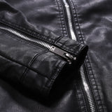 Men's black leather motorcycle jacket with zippered and buttoned collar, showcasing stylish design and detailing.