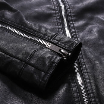 Men's black leather motorcycle jacket with zippered and buttoned collar, showcasing stylish design and detailing.