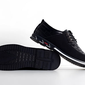 Men's black lightweight sneakers with breathable mesh upper, featuring non-slip synthetic rubber soles and shock-absorbing design, ideal for walking and sports activities.
