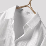 Men's black linen shirt featuring long sleeves, a classic collar, and lightweight, breathable fabric suitable for eco-conscious fashion.