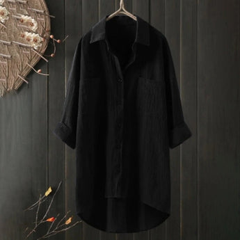 Men's black linen shirt hanging on a clothes hanger, featuring long sleeves and a collar. The shirt is lightweight, breathable, and eco-friendly, and is available in size 5XL.