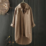 Men's black linen shirt on a clothes hanger, featuring long sleeves and a classic collar, designed for lightweight, breathable comfort and eco-friendly fashion.