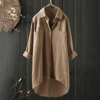 Men's black linen shirt on a clothes hanger, featuring long sleeves and a classic collar, designed for lightweight, breathable comfort and eco-friendly fashion.