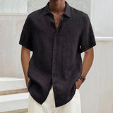 Men's black linen short sleeve shirt with a collar and button front, displayed on a mannequin or model showing the chest and waist area, highlighting the lightweight and breathable fabric perfect for summer wear.