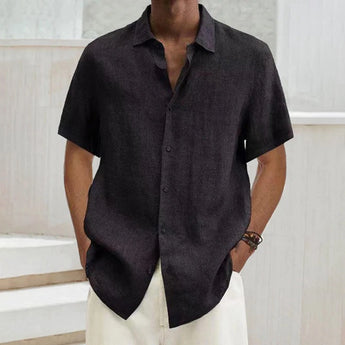 Men's black linen short sleeve shirt with a collar and button front, displayed on a mannequin or model showing the chest and waist area, highlighting the lightweight and breathable fabric perfect for summer wear.