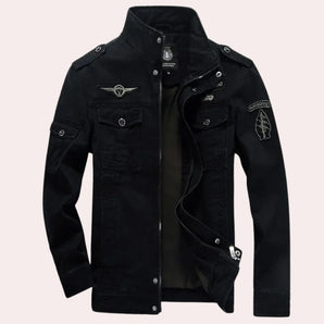 Men's black military cargo jacket with embroidered patches, featuring a slim fit design. The jacket showcases button details, a structured collar, long sleeves, and a sleek, formal appearance.
