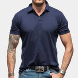 Men's marine blue muscle-fit polo shirt in size 2XL, featuring a stretch fabric for athletic wear, with a clean collar and short sleeves.