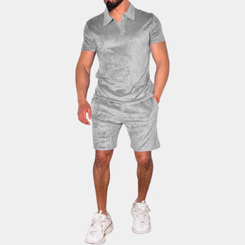 Men's gray polo and shorts set, featuring a slim fit design, perfect for summer wear; the outfit includes a short-sleeve polo shirt and matching shorts that reach mid-thigh, highlighting the arm and leg muscles for a sporty and breathable look.