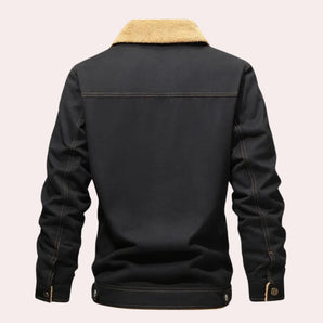 Men's black trucker jacket featuring a warm sherpa collar, durable material, and stylish design suitable for winter fashion.