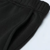 Men's black sherpa-lined thermal fleece hoodie featuring long sleeves, a warm fleece lining, and spacious front pockets, designed for winter wear.