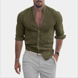 Men's green slim fit casual shirt with a textured v-neck and rolled sleeves, worn by a bearded model showcasing a muscular build, with the shirt highlighting the neck and waist areas.