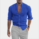 Men's model wearing a black slim fit casual shirt with a textured V-neck and rolled sleeves, showcasing a relaxed yet stylish look.