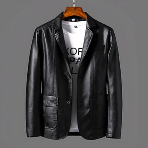 Men's black slim fit leather jacket with a casual button-front design, featuring a blazer style with a collar and long sleeves, made from natural leather material.