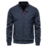 Men's black slim fit lightweight bomber jacket featuring a water-resistant material with a sleek collar and long sleeves, displayed on a hanger against a neutral background.
