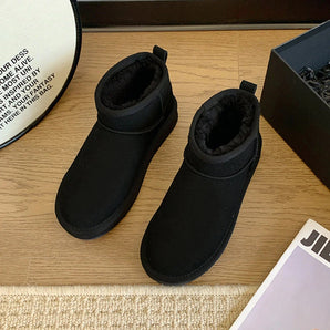 Men's black slip-on winter boots with fleece lining and non-slip durable soles, designed for cold weather comfort and style.
