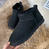Men's black slip-on winter boots with fleece lining, featuring a durable and non-slip sole.