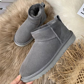 Men's gray slip-on winter boots featuring a fleece lining for warmth, a non-slip sole for safety, and a durable design suitable for outdoor use.