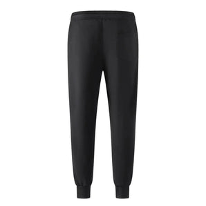 Men's black tapered joggers featuring a slim-fit design with an elastic waistband and zippers at the ankles.