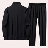 Men's black tracksuit set featuring a long-sleeved top with a collar and patterned design, suitable for winter comfort and sportswear activities.