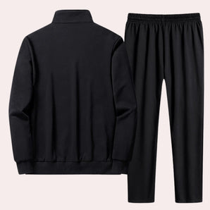 Men's black tracksuit set featuring a long-sleeved top with a collar and patterned design, suitable for winter comfort and sportswear activities.