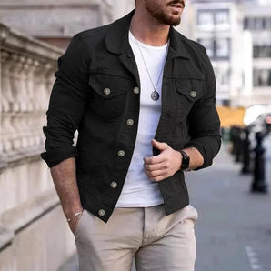 Men's black utility jacket in size 2XL, featuring long sleeves, a collar, and a lightweight design, suitable for spring outerwear. The jacket is worn by a person with a beard.