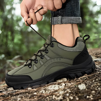 Men's green lightweight hiking shoes showcased in a natural outdoor setting, designed for waterproof performance, with non-slip soles for secure footing on trails; size 49 displayed.