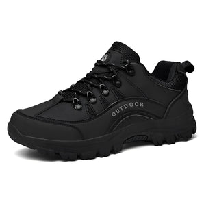 Men's black waterproof hiking shoes designed for lightweight and non-slip performance on trails, featuring durable construction and an athletic style suitable for outdoor activities.