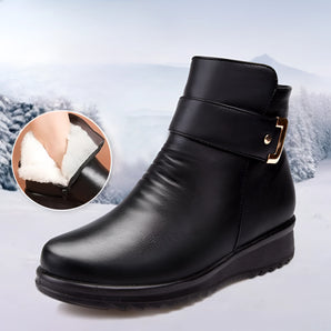 Men's black waterproof leather ankle boots with a sleek design, featuring thermal insulation and slip-resistant soles.