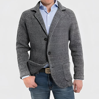 Men's dark gray knit blazer with notch lapel, featuring a casual wool design, worn over a shirt.
