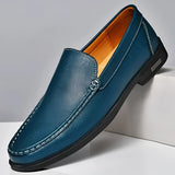 Men's blue leather loafers with a metal buckle, featuring a slip-on design and a sleek, electric blue finish.