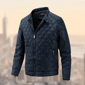 Men's blue lightweight insulated quilted winter jacket in size 2XL, featuring long sleeves, a collar, and a buttoned front closure. The jacket's quilted pattern is accentuated in an electric blue color.