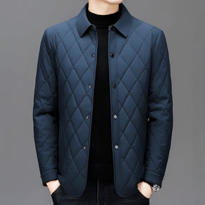 Men's blue lightweight quilted bomber jacket in designer style, featuring a sleek azure color with black accents, a comfortable neck design, and long sleeves.