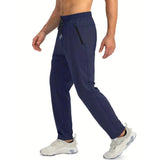 Men's blue quick-dry athletic shorts featuring zipper pockets, displayed against a neutral background, showcasing the comfortable fit around the waist and thighs ideal for sports activities.