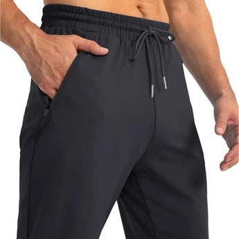 Men's blue quick-dry athletic shorts with zipper pockets, showcasing features such as a comfortable waistband, tailored fit, and durable material suitable for active wear.