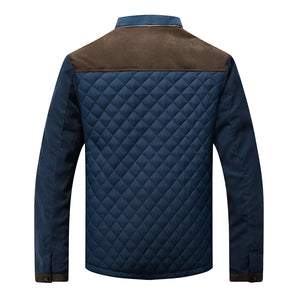 Men's blue quilted jacket with a suede collar, featuring long sleeves and an insulated design for winter fashion.
